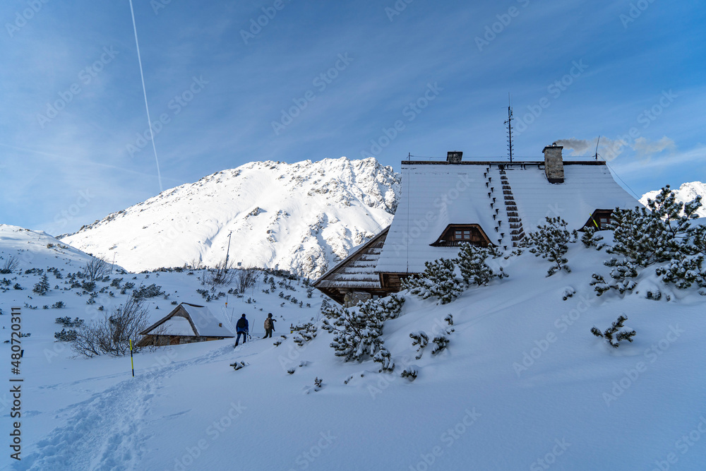 Obraz premium house for tourists in the Tatra Mountains in the middle of high mountains in the snow in winter Poland