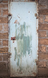 Old iron door with paint. Old iron door with old paint. Old blue iron door. Old paint