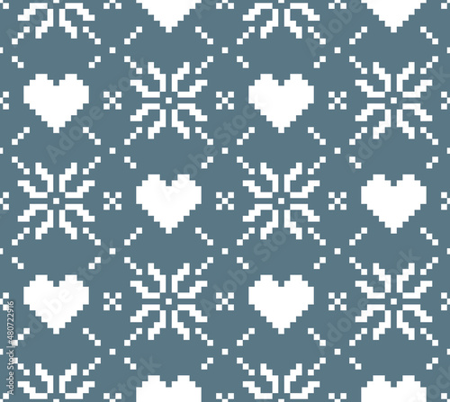 Scandinavian knitting seamless pattern design. Nordic star with heart pattern in white and blue.