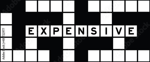 Alphabet letter in word expensive on crossword puzzle background