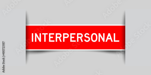 Inserted red color label sticker with word interpersonal on gray background