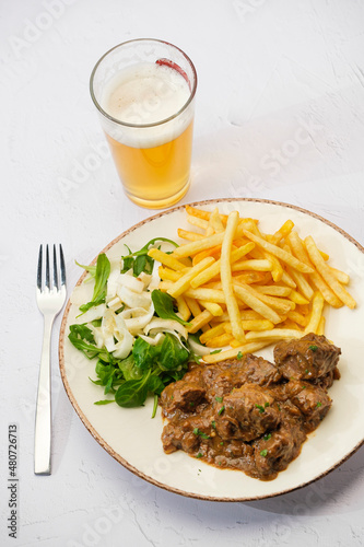 Belgian Beef stew with french fries photo