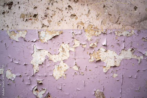 cracked and peeling paint and grunge old wall with texture photo