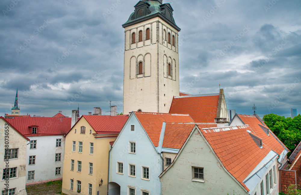 St Nicholas Church and colorful buildings in Tallinn Old Town, Estonia.