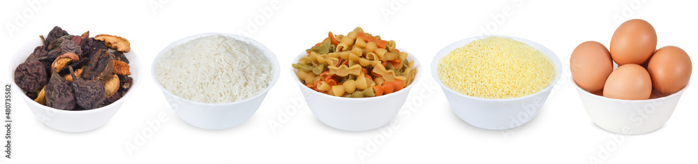 Colored pasta, chicken eggs, rice, dried fruits and couscous in a bowl isolated on a white background. Set of full white bowl Colored pasta, chicken eggs, rice, dried fruits and couscous in a bowl isolated on a white background. Set of full white bowl