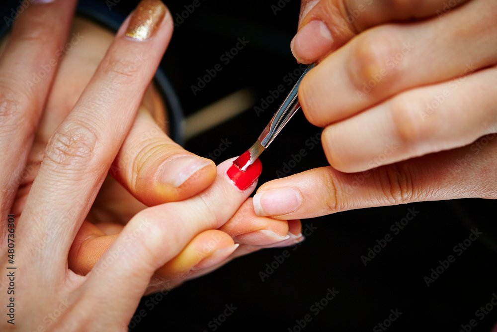 Nail art, close-up of hands trimming nails Nail art, close-up of hands trimming nails