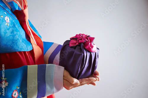 Traditional gift held by a woman in hanbok photo