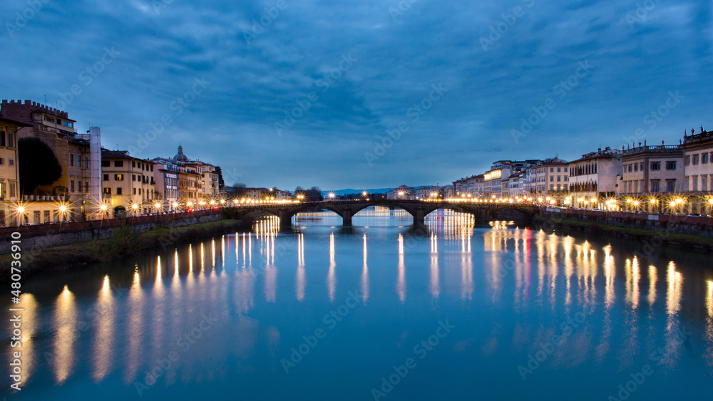 florence city in the evening over the arno river.