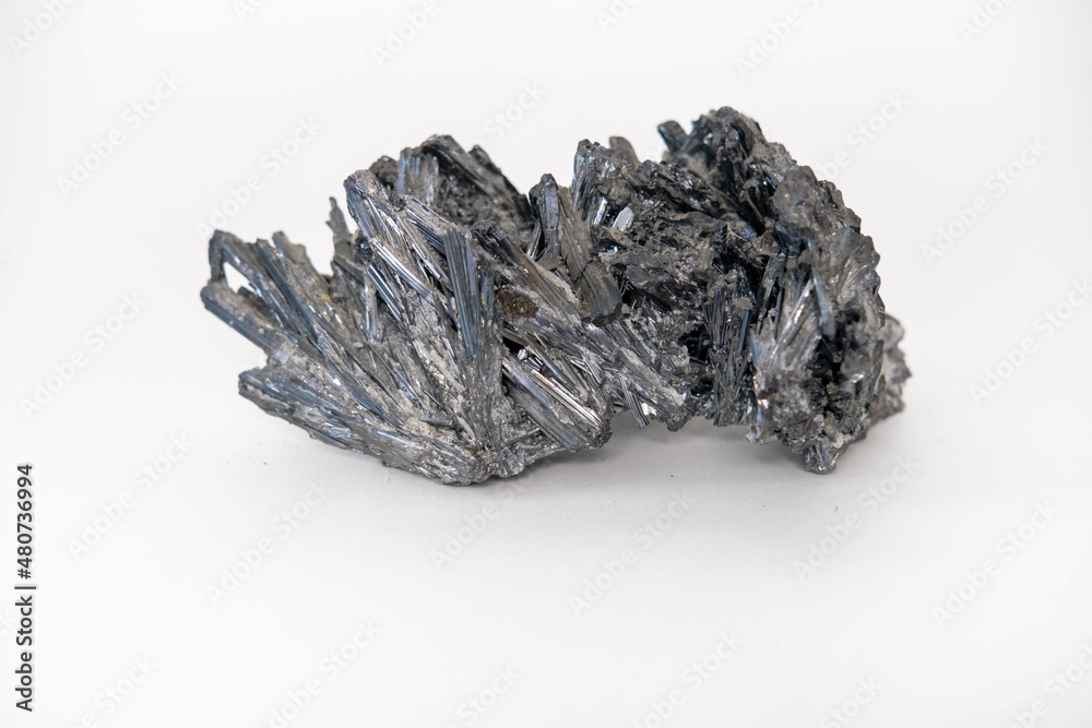 Mineral crystals of natural antimonite. Isolated on a white background.