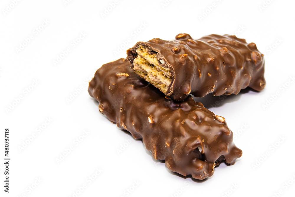 Wafers, cookies and sweets concept with hazelnut and chocolate. Cracked chocolate bar with snack wafers. Wafers, cookies and sweets concept with hazelnut and chocolate. Cracked chocolate bar with snack wafers.
