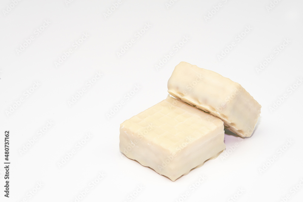 Vanilla wafers isolated on white background. Wafers filled with chocolate and vanilla cream. 