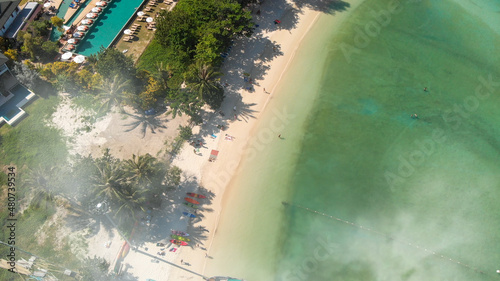 Phi Phi Don, Thailand. Overhead aerial view of Phi Phi Island coastline and beach from drone on a hot sunny day.