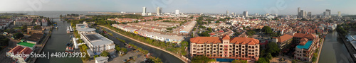 Malacca, Malaysia. Panoramic aerial view of city skyline and river from drone on a hot sunny day