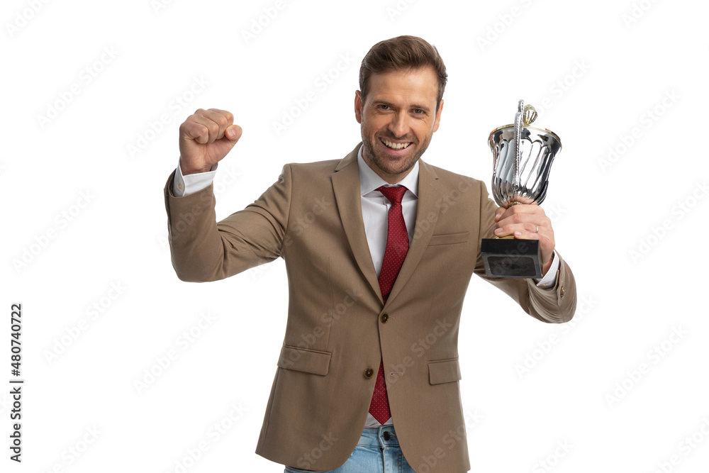excited businessman celebrating success with his cup in the air excited businessman celebrating success with his cup in the air