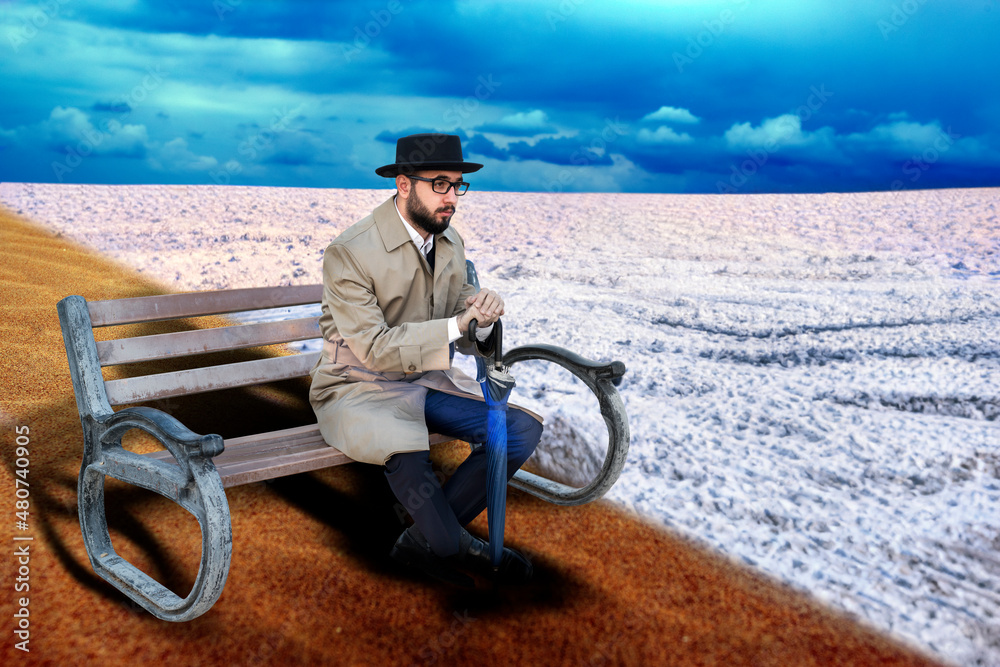 Desert and snow, summer and winter. The man sitting in contrasts.