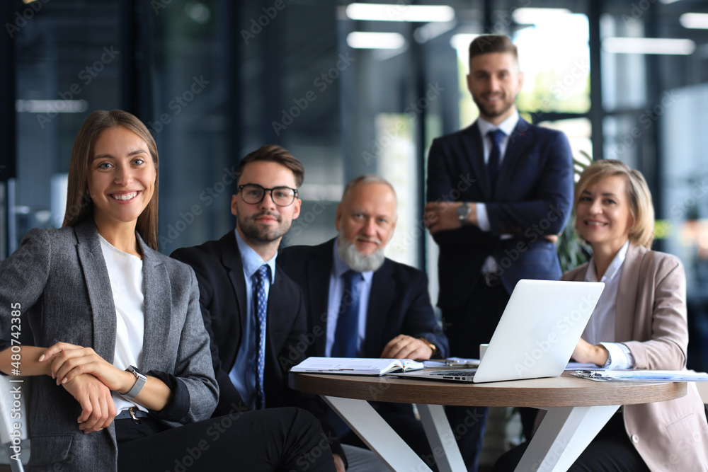 Portrait of a positive business employees at an office business meeting. Portrait of a positive business employees at an office business meeting.