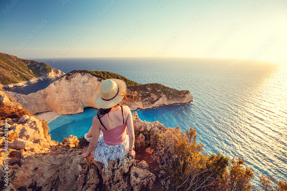 Obraz na płótnie Woman tourist in Zakynthos, Greece admiring the Navagio beach w salonie