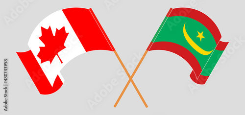 Crossed and waving flags of Canada and Mauritania