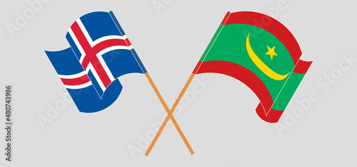 Crossed and waving flags of Iceland and Mauritania