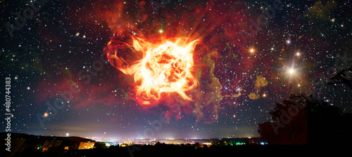 Photos Fantastic night sky over the city with a view of an asteroid explosion in the earth's atmosphere