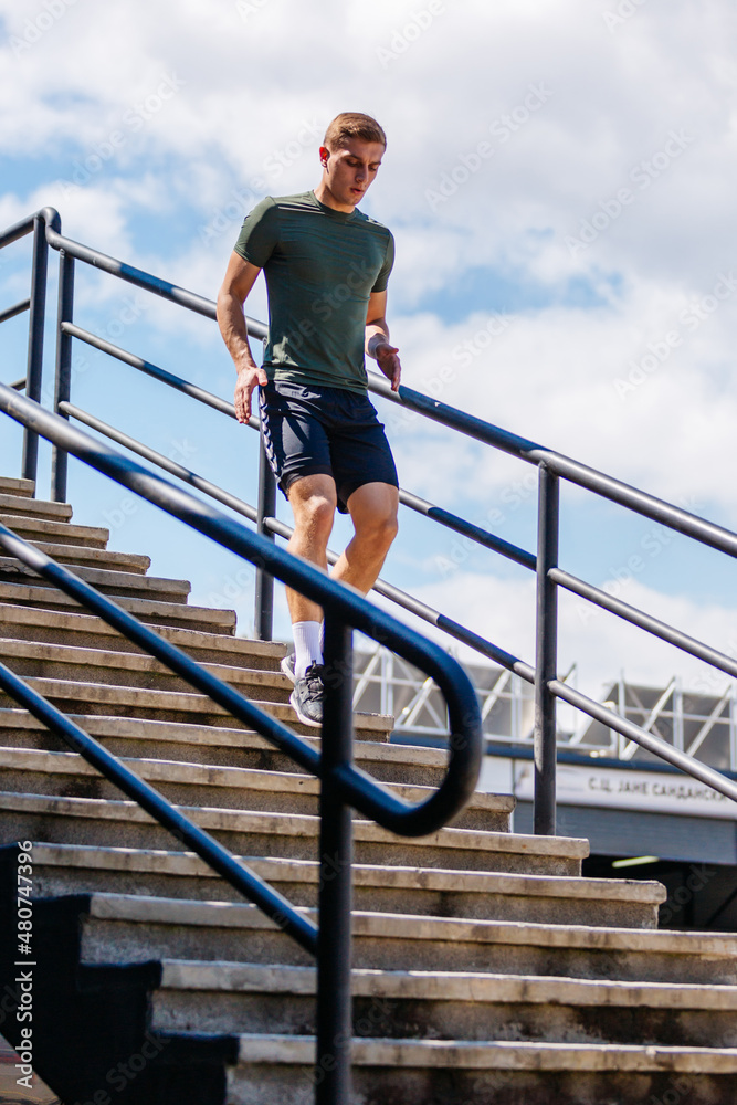 Sport man running. Portrait of runner man jogging in park. Sport workout outdoor. Athlete training run exercise Sport man running. Portrait of runner man jogging in park. Sport workout outdoor. Athlete training run exercise