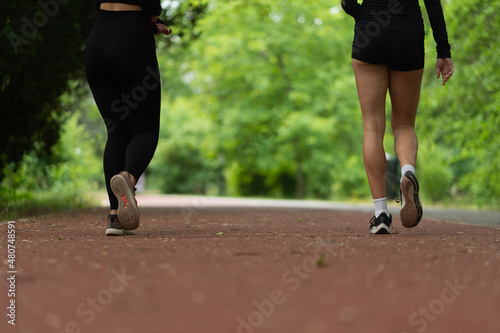 Two girls walking, close up