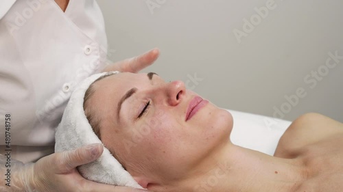 Female doctor exam person skin. Female patient consultation. Dermatology aesthetic surgery preparation. Spa salon facial treatment video. Luxury hospital check. Rejuvenation touch. Hands in gloves