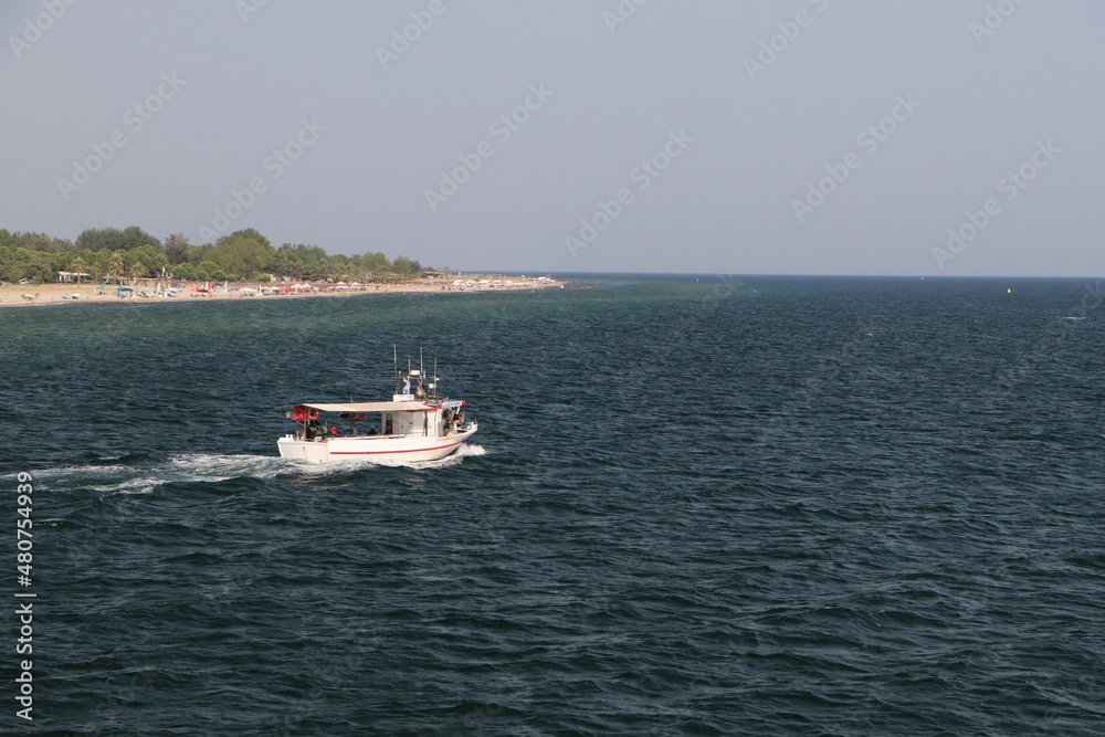 Boat cruising on the calm sea
