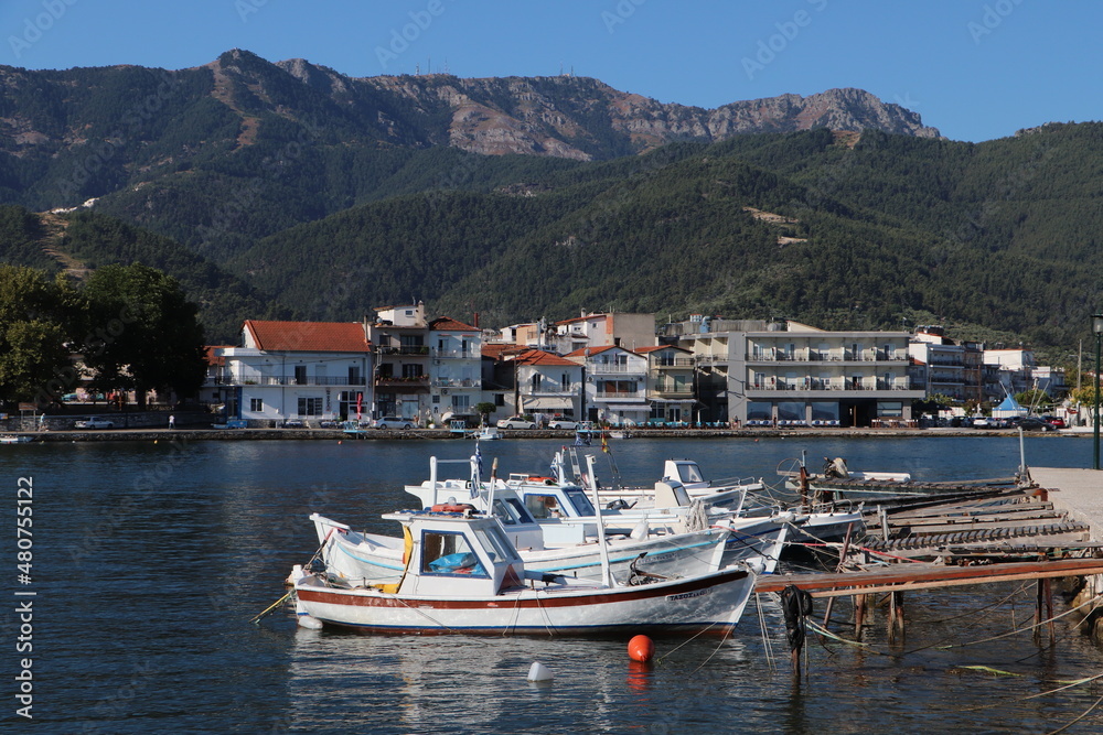 Boats in the old harbor of Limenas city