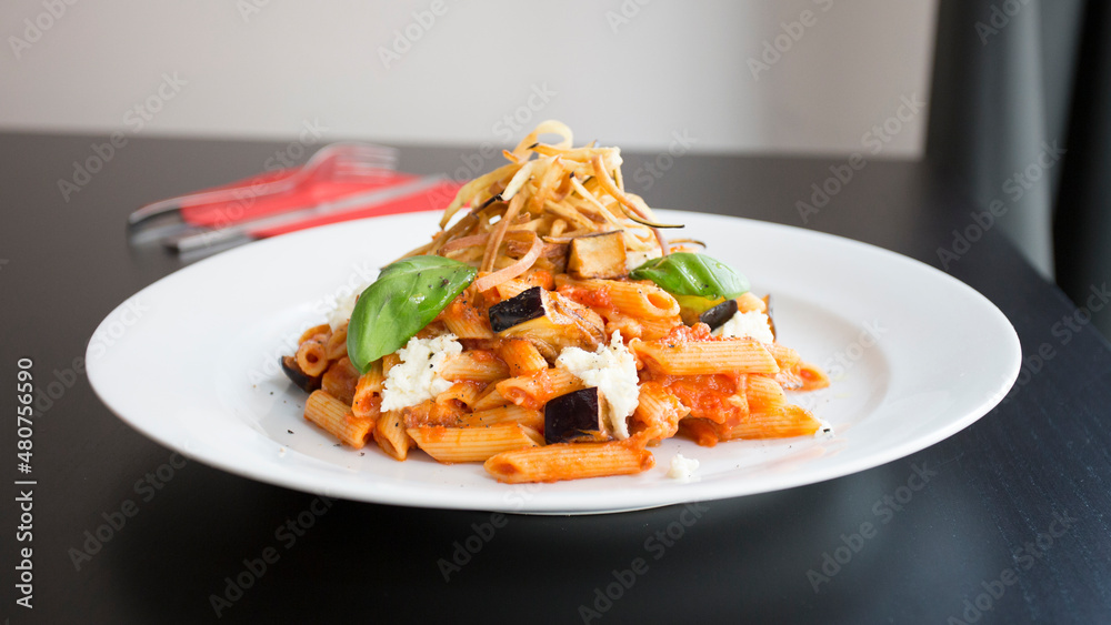 Pasta alla norma. Traditional Italian pasta recipe with eggplant.