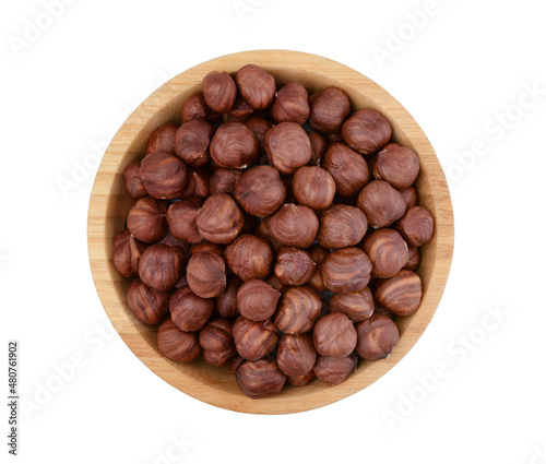 Hazelnuts in a wooden bowl isolated.