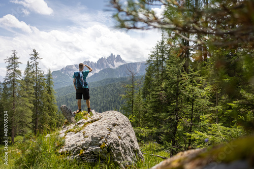 Hiker enjoying a beautiful view in the Dolomite Mountains