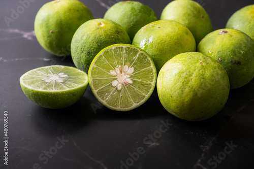 Fototapeta Naklejka Na Ścianę i Meble -  Fresh lime fruits with dark background