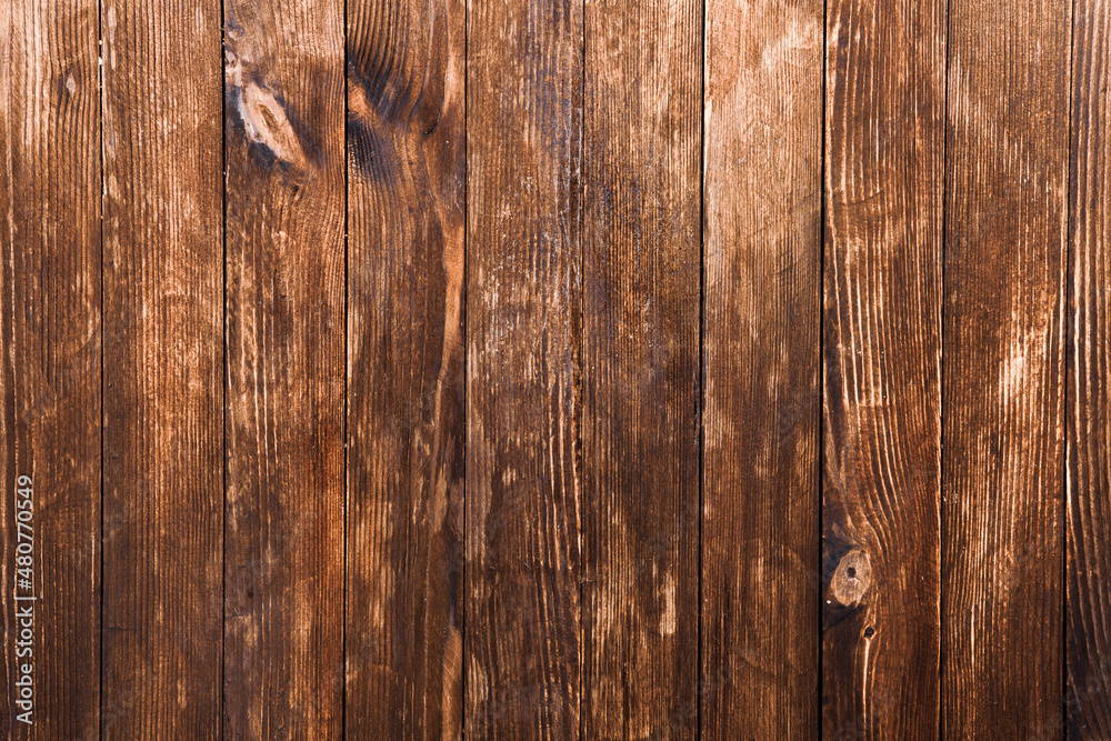 Naklejka premium Vintage brown wood background texture with knots and nail holes. Old painted wood wall. Wooden dark horizontal boards