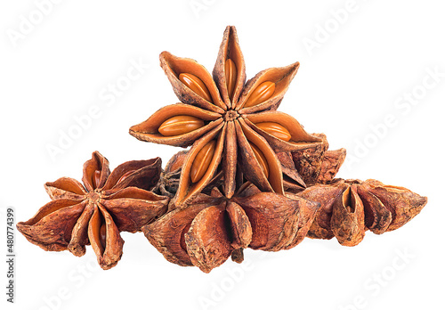 Pile of anise star spice fruits and seeds isolated on a white background