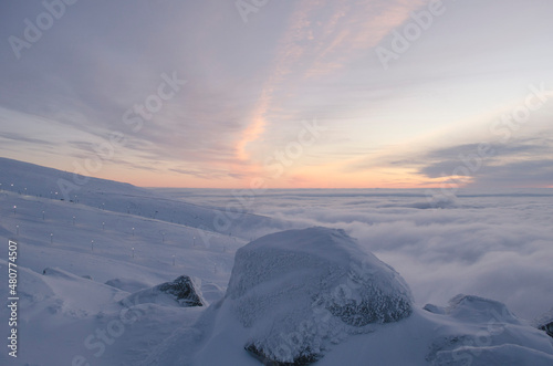 The Khibiny peaks lighted by the  sun  winter background photo