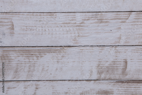 Vintage white wood background texture with knots and nail holes. Old painted wood wall.