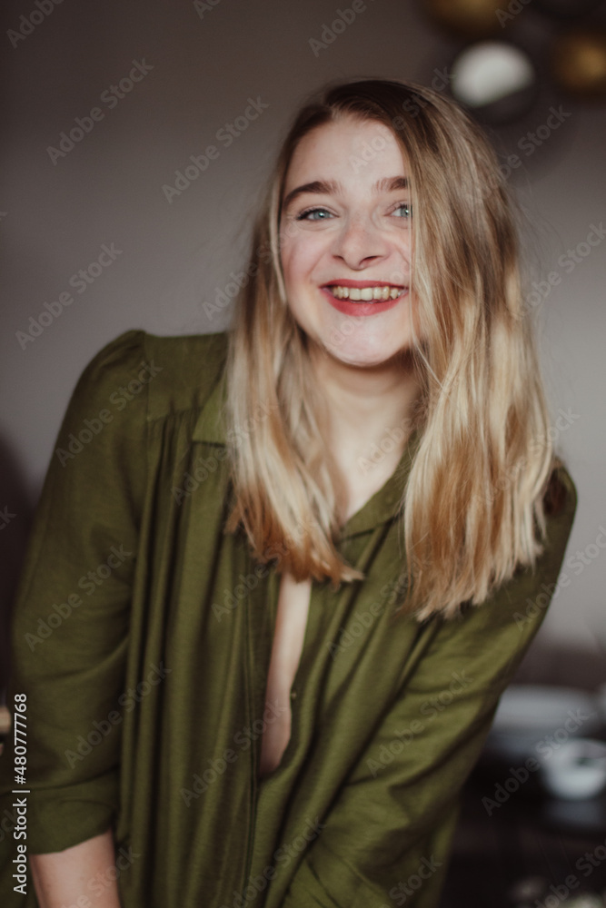 Blonde, blue-eyed girl, smiling and facing a camera. Self-portrait. Blonde, blue-eyed girl, smiling and facing a camera. Self-portrait.