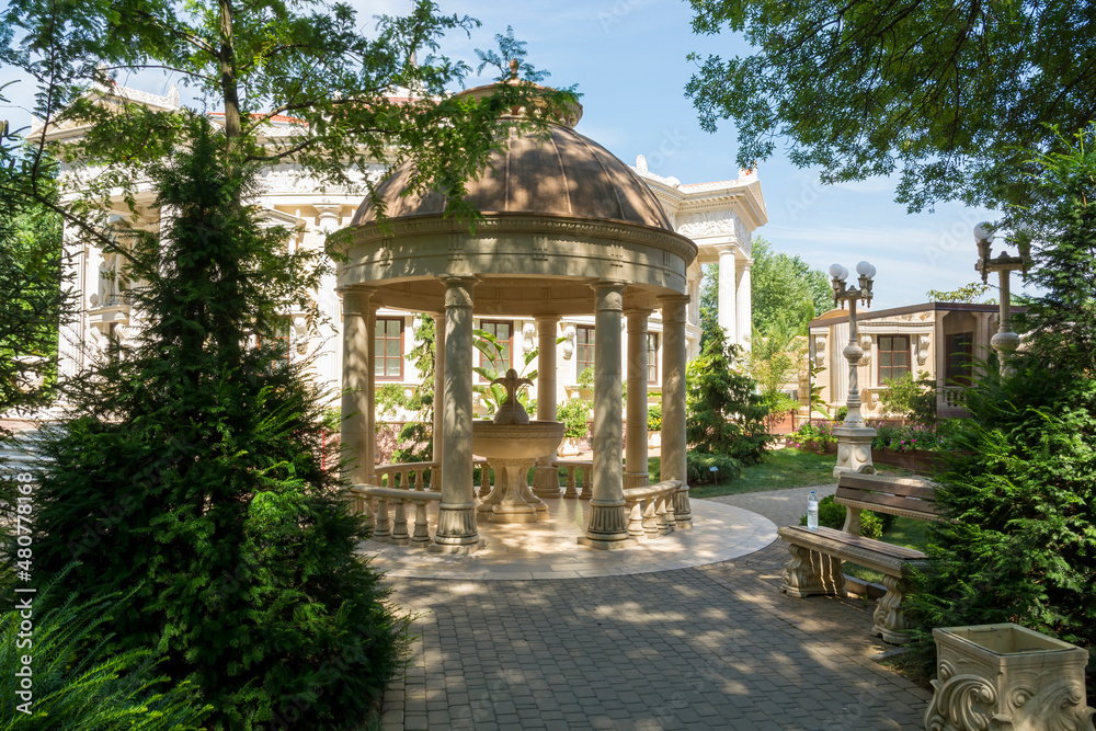 Stone gazebo in the old style with a fountain in the old park of the village of Kabardinka of the Krasnodar Territory of Russia