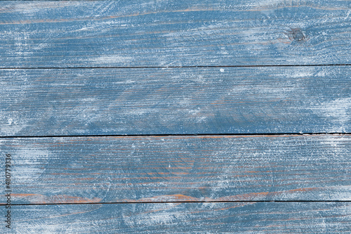 Vintage blue wood background texture with knots and nail holes. Old painted wood wall. Blue abstract background.