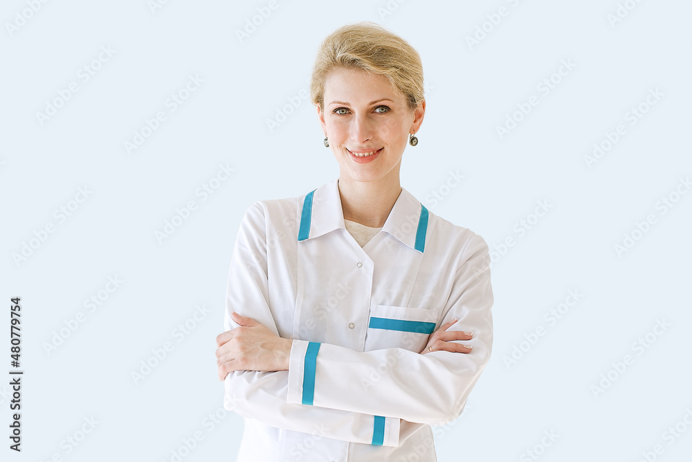 Portrait of cheerful young medical doctor smiling at camera isolated over grey color background Portrait of cheerful young medical doctor smiling at camera isolated over grey color background