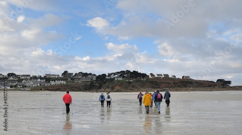 Senior hikers walking along the coast in Brittany-France