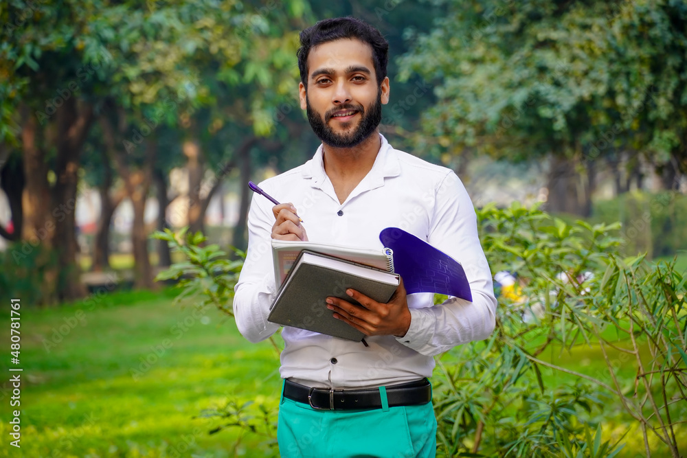 Fototapeta premium Writing something Indian boy images college student Indian