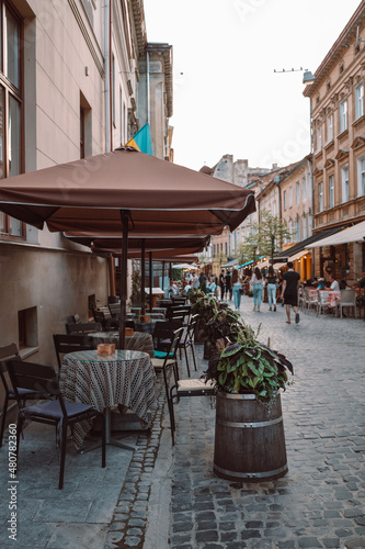 Fototapeta Naklejka Na Ścianę i Meble -  Cafe in the center in old city center of Lviv on a summer sunny day