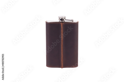Stainless steel hip flask with leather cover isolated on white background photo