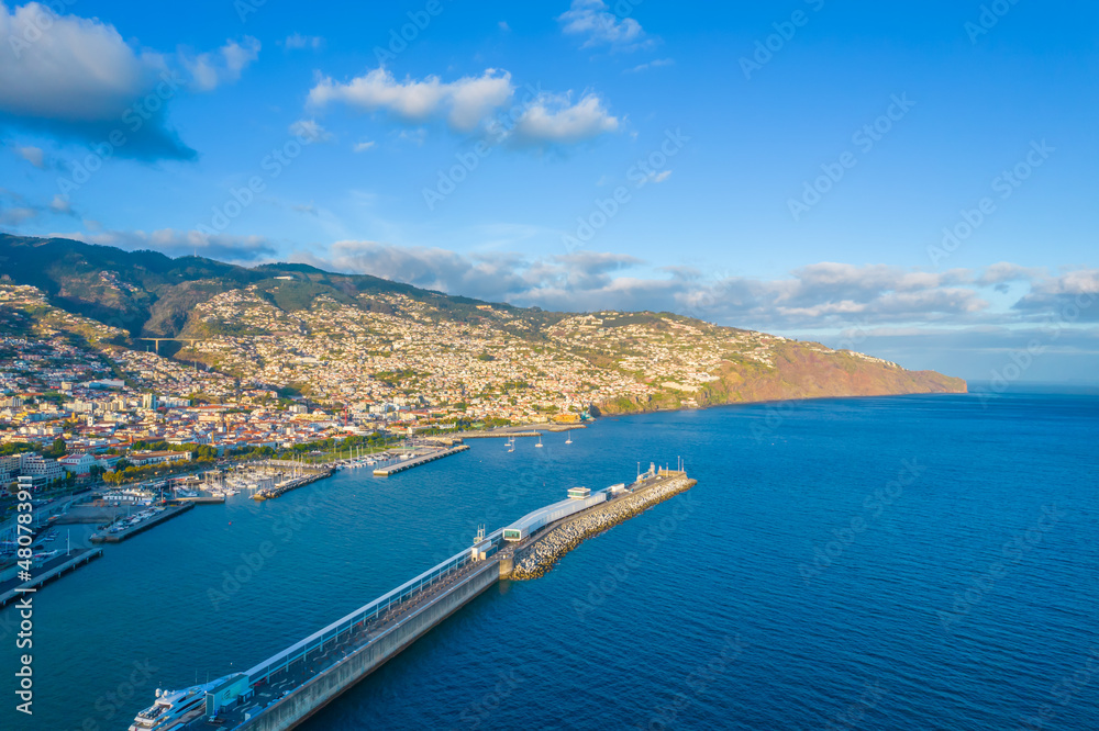 Aerial view of Funchal port and residential areas in the mountains in Funchal, Madeira 