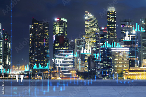 Rooftop with concrete terrace, Singapore night skyline. Forecasting and business modeling of financial markets hologram digital charts. City downtown. Double exposure.