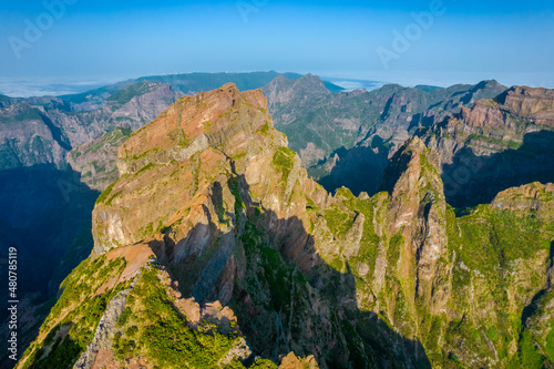 Aerial view of the mountains range peaks in Madeira Island during a sunset