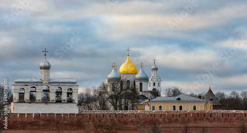 View of the domes of the Hagia Sophia, the Belfry and the fortress wall of the Detinets Kremlin in Veliky Novgorod. photo