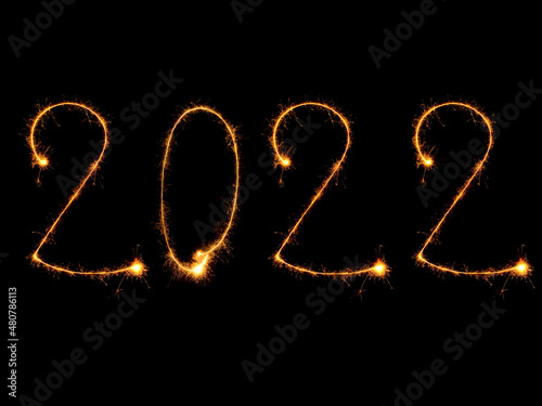 Sparkling burning numbers Year 2022 isolated on black background.